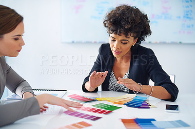Buy stock photo Cropped shot of two designers looking at color swatches
