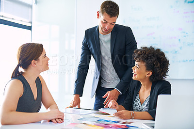Buy stock photo Cropped of a group of designers looking at color swatches