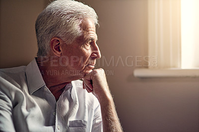 Buy stock photo Shot of a senior man looking thoughtful
