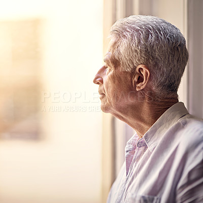 Buy stock photo Shot of a senior man looking thoughtful