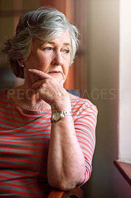 Buy stock photo Shot of a senior woman looking thoughtful