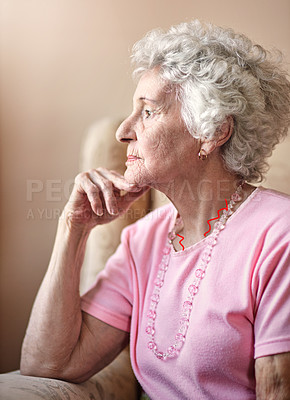 Buy stock photo Shot of a senior woman looking thoughtful
