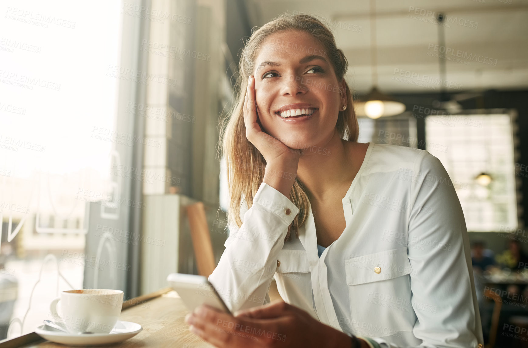 Buy stock photo Shot of an attractive young woman in a coffee shop