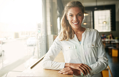 Buy stock photo Shot of an attractive young woman in a coffee shop