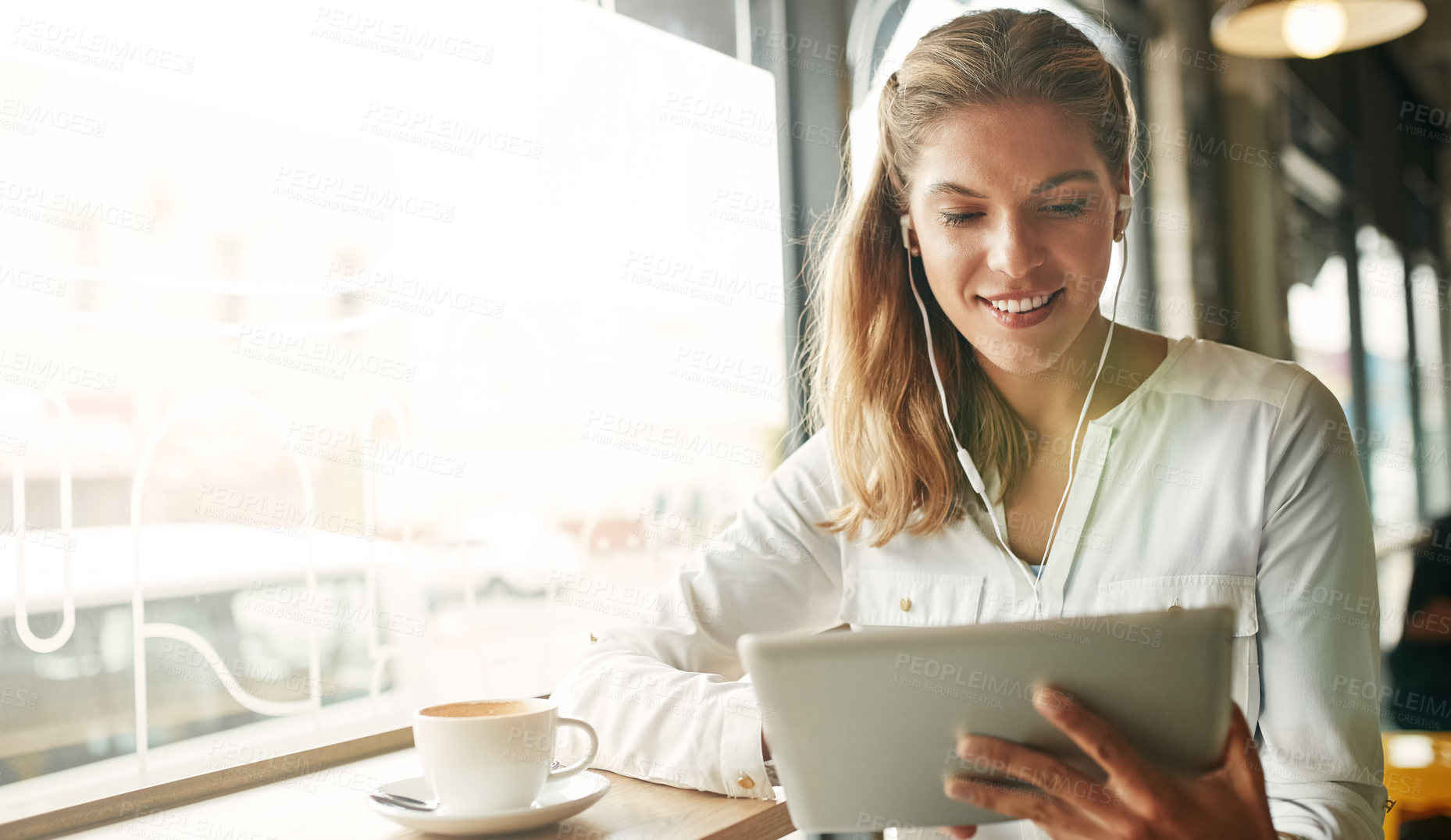 Buy stock photo Woman, tablet and coffee shop for listening to music, earphones and website for streaming radio. Female person, restaurant and surfing social media on internet, relax and cup of espresso for podcast