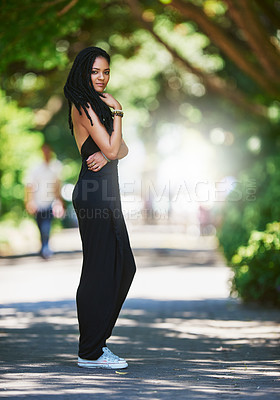 Buy stock photo Portrait of an attractive young woman posing outdoors