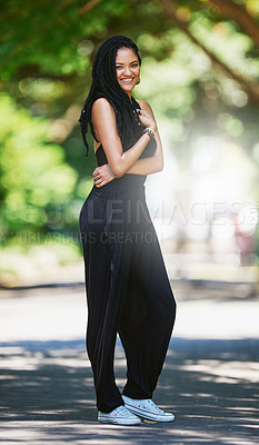 Buy stock photo Portrait of an attractive young woman posing outdoors