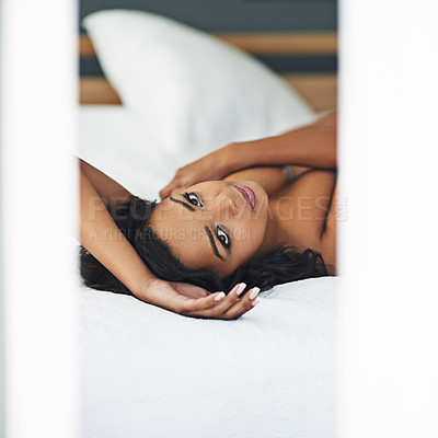 Buy stock photo Portrait of a gorgeous young woman posing seductively in her bedroom