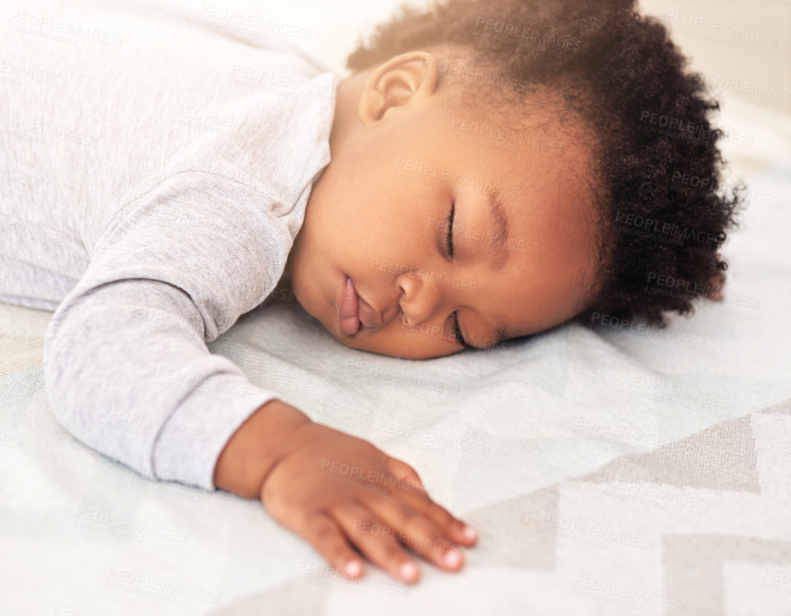 Buy stock photo Baby, african boy and sleep in bedroom for rest, health and peace for growth, development and relax in family home. Black male infant, tired and sleeping on bed with fatigue, quiet and calm in house