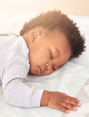 Buy stock photo Tired, bed and baby sleeping in home on blanket for rest, nap time and dreaming in nursery. Childcare, newborn and cute, adorable and African child in bedroom sleep for comfort, relaxing and calm