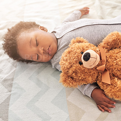 Buy stock photo Sleeping, teddy bear and cute with baby in bedroom for carefree, development and innocence. Dreaming, relax and comfortable with african infant and toy at home for morning, resting and bedtime