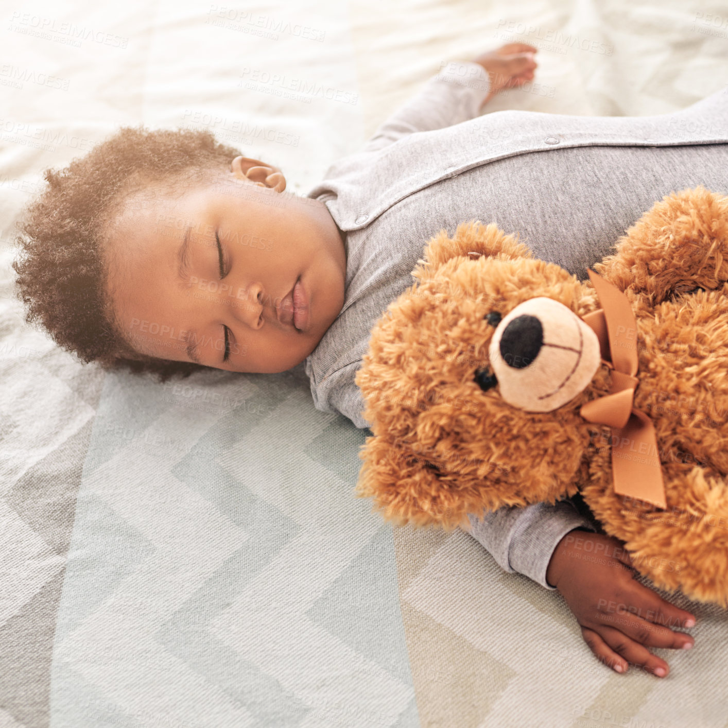 Buy stock photo Sleeping, teddy bear and cute with baby in bedroom for carefree, development and innocence. Dreaming, relax and comfortable with african infant and toy at home for morning, resting and bedtime