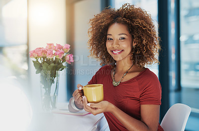 Buy stock photo Shot of a young businesswoman having coffee at her desk