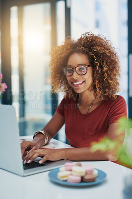 Buy stock photo Shot of a young businesswoman working on a laptop at her desk