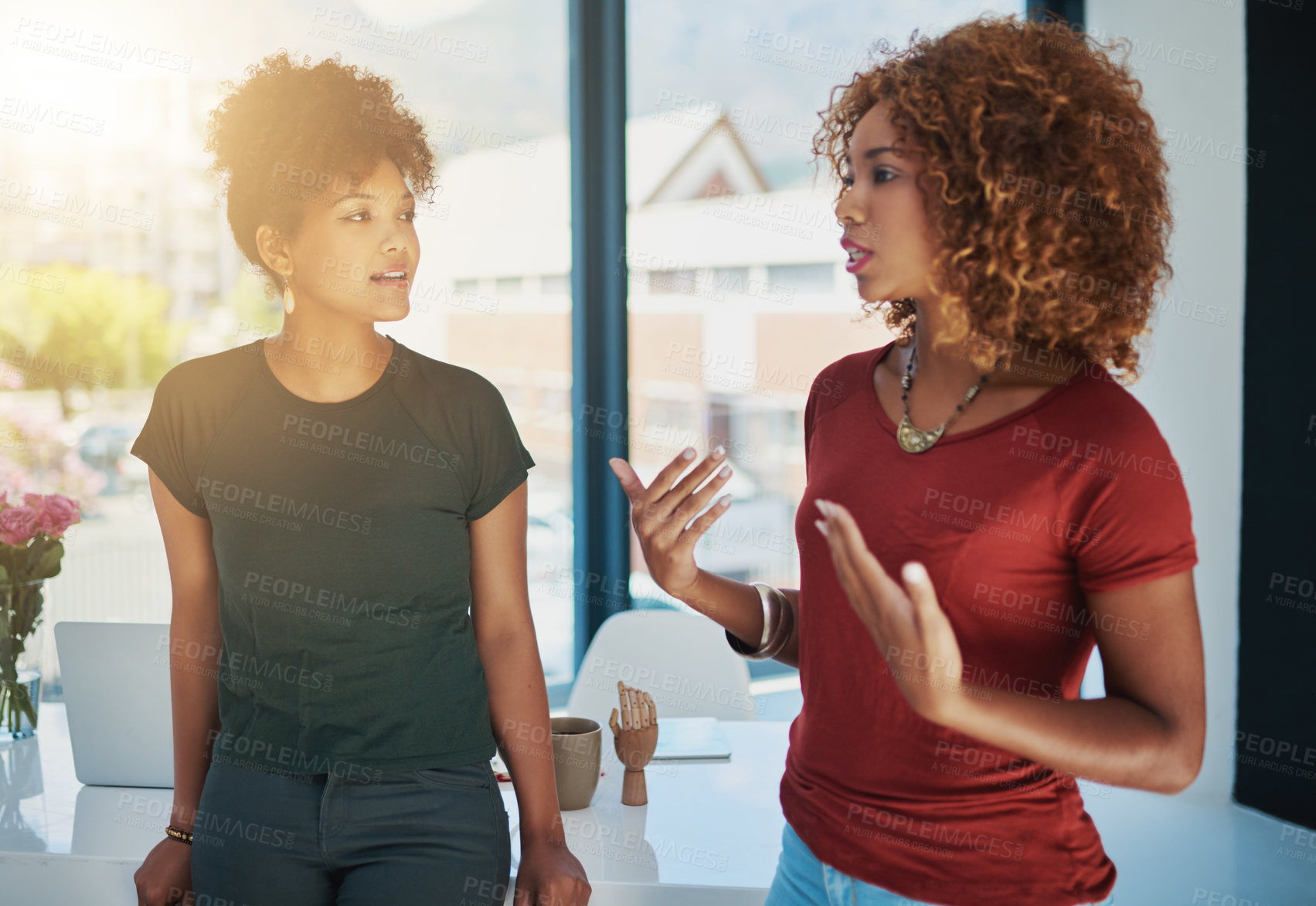 Buy stock photo Listening, smile and discussion for project, black women and planning in office, web designer and help with idea. Laptop, online and talking for brainstorming, creative and together in collaboration