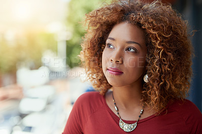 Buy stock photo Shot of a young businesswoman standing outside on a balcony