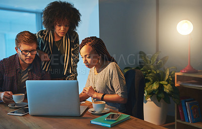 Buy stock photo Cropped shot of a group of young people working late in the office