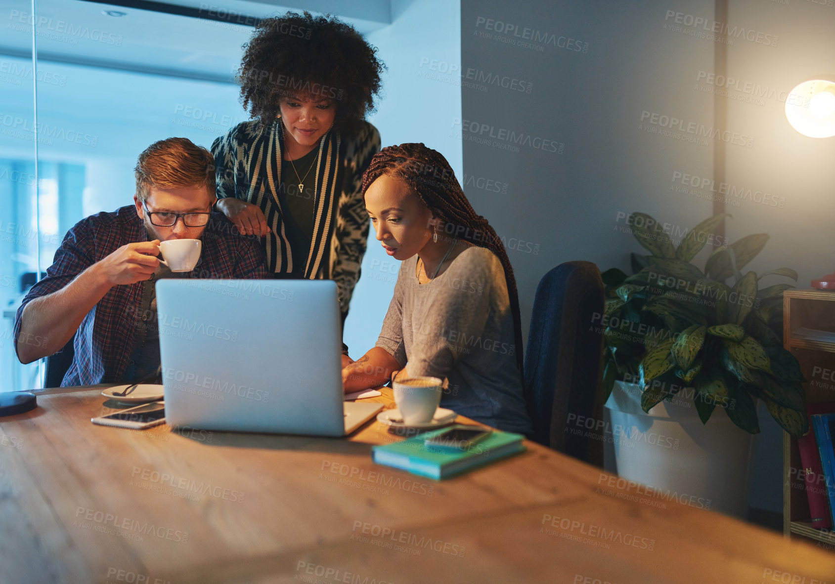 Buy stock photo Cropped portrait of a group of young people working late in the office