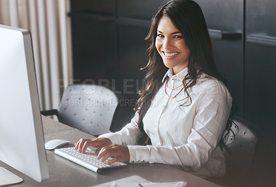 Buy stock photo Portrait of a young businesswoman working on a computer at work