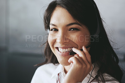 Buy stock photo Shot of a friendly support agent working in an office