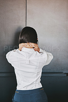 Buy stock photo Rearview shot of a businesswoman suffering from neck pain at the office