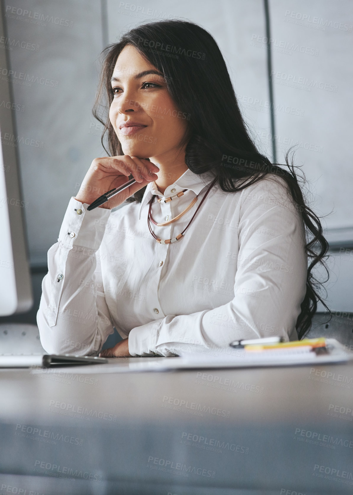 Buy stock photo Shot of a young businesswoman working on a computer at work