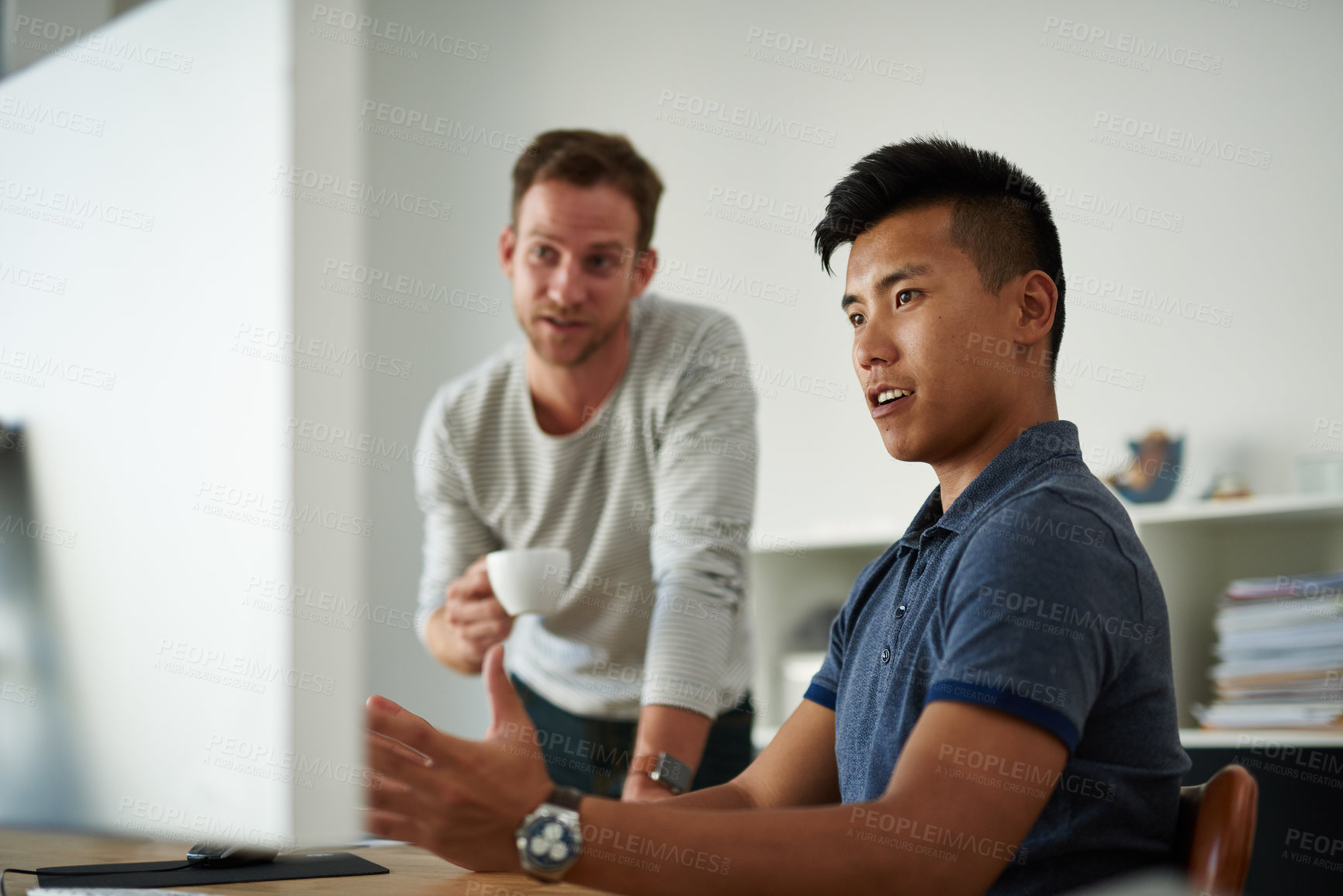 Buy stock photo Cropped shot of two designers working together on a project in an office