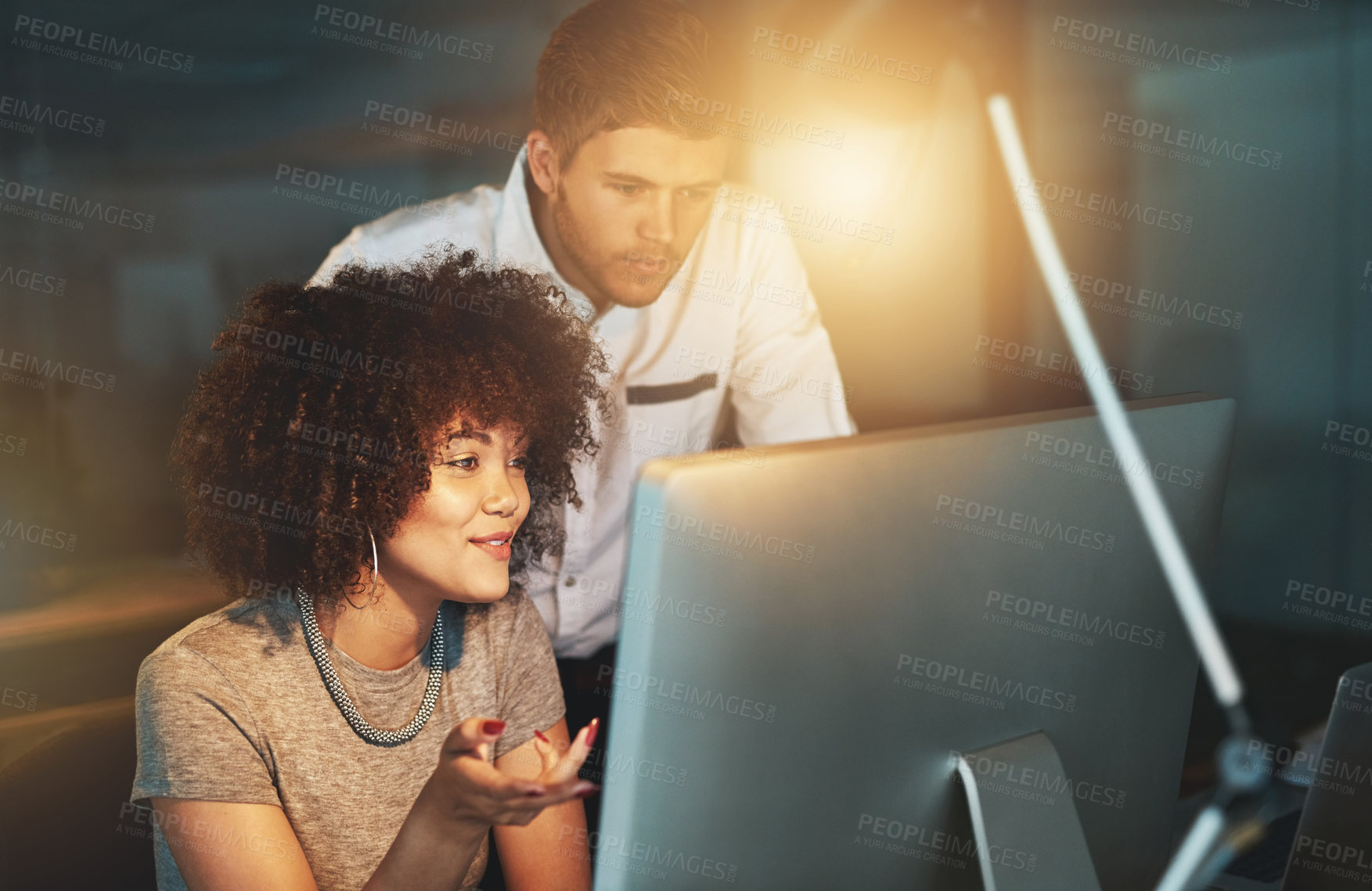 Buy stock photo Night, woman and partner on computer in office for information, research and teamwork for project management. Smile, people and manager on pc with planning, support and overtime for proposal solution