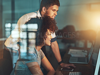 Buy stock photo Shot of colleagues working late at the office