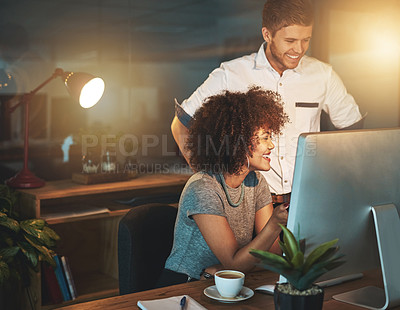 Buy stock photo Shot of colleagues working late at the office