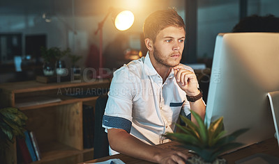 Buy stock photo Shot of a young designer working late