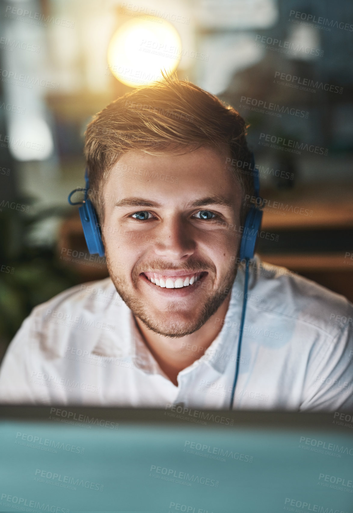 Buy stock photo Businessman, computer and headphones in portrait at night, research and web designer for proposal. Male person, employee and streaming music on website for online tasks, project and audio in office