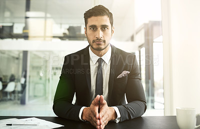 Buy stock photo Shot of a businessman sitting in an office