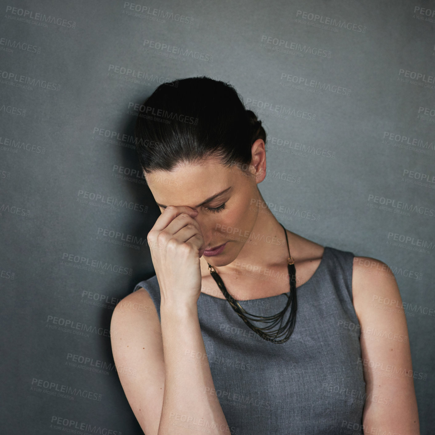 Buy stock photo Studio shot of a businesswoman looking stressed out against a grey background