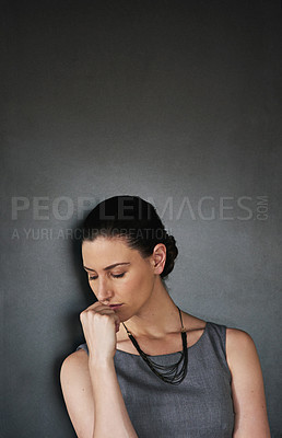 Buy stock photo Studio shot of a businesswoman looking stressed out against a grey background