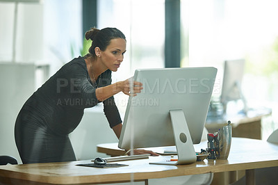 Buy stock photo Shot of a pregnant businesswoman working in an office