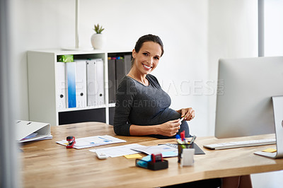 Buy stock photo Portrait of a pregnant businesswoman working in an office