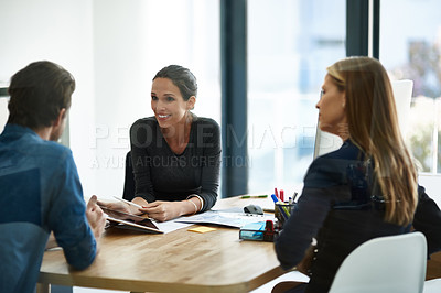 Buy stock photo Shot of a group of businesspeople having a meeting together in an office