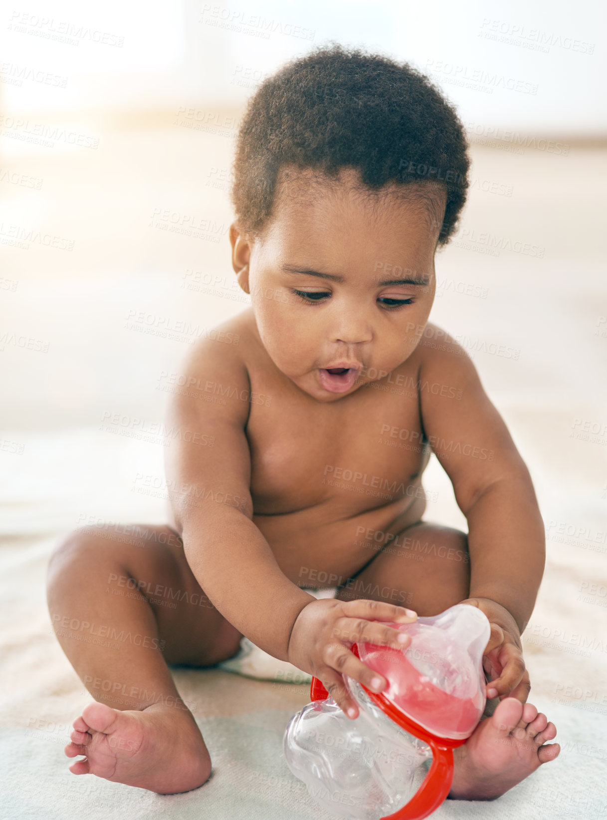 Buy stock photo Kids, black baby and girl with a bottle sitting on a blanket on the floor of a home for child development. Children, cute and curious with a newborn infant learning or growing alone in a house