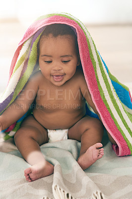 Buy stock photo African baby, girl and sitting for smile with blanket, young or healthy in bedroom at family home. Black infant, toddler and bed with towel for growth, care and health in morning sunshine at house