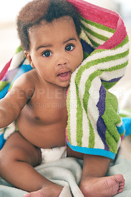 Buy stock photo African baby, girl and sitting for portrait with blanket, young or healthy in bedroom at family home. Infant black person, bed and towel for growth, development or health in morning sunshine at house