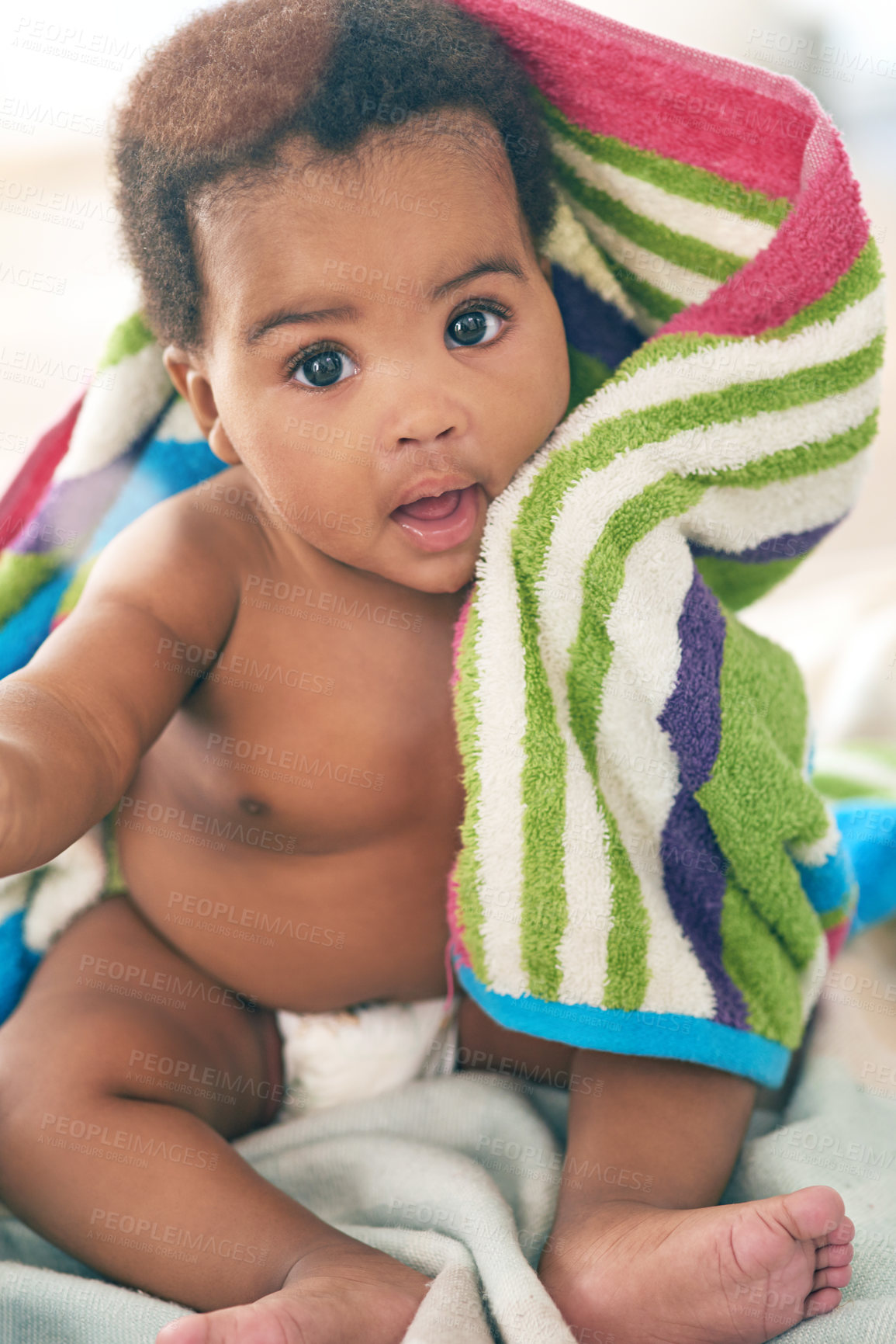 Buy stock photo African baby, girl and sitting for portrait with blanket, young or healthy in bedroom at family home. Infant black person, bed and towel for growth, development or health in morning sunshine at house