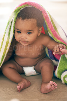 Buy stock photo Baby, infant and child development for little or small kid in a towel being cute, curious and adorable in a home or house. Children, innocent and babies or newborn playing and sitting on a table 