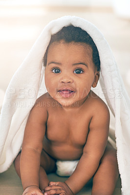Buy stock photo Portrait, baby and kid covered in a towel at home, relaxing and sitting on floor. Innocent face, cute and adorable happy black child, infant or newborn toddler with happiness, joy or comfort in house