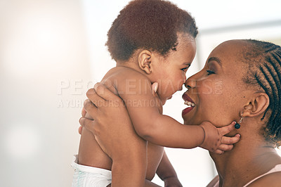 Buy stock photo Smile, touch and nose with mother and baby for bonding, affectionate and connection in family home. Kindness, happiness and happy with black woman holding child for positive, growth and support