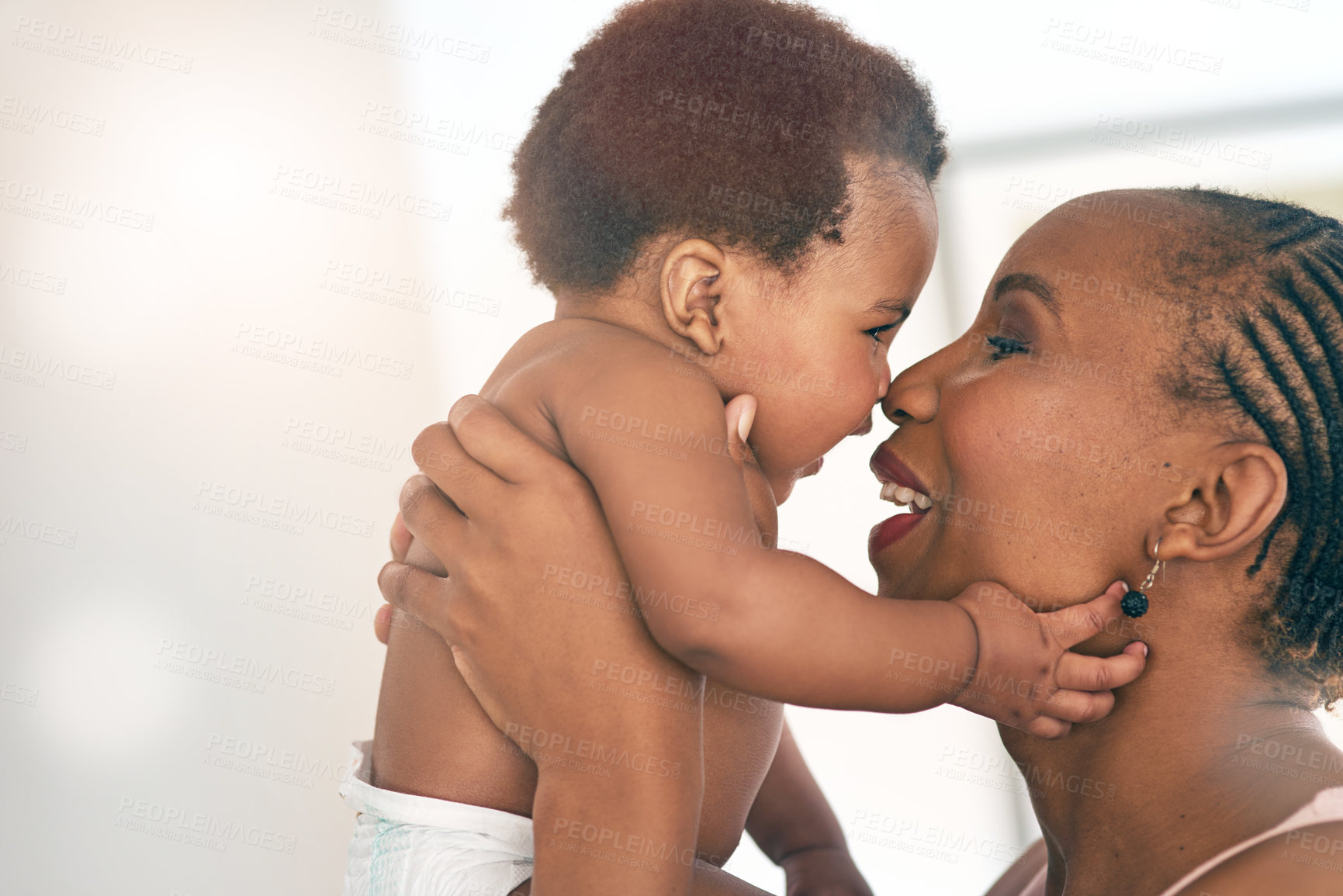 Buy stock photo Smile, touch and nose with mother and baby for bonding, affectionate and connection in family home. Kindness, happiness and happy with black woman holding child for positive, growth and support