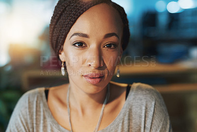 Buy stock photo Cropped portrait of a young woman working late in her office