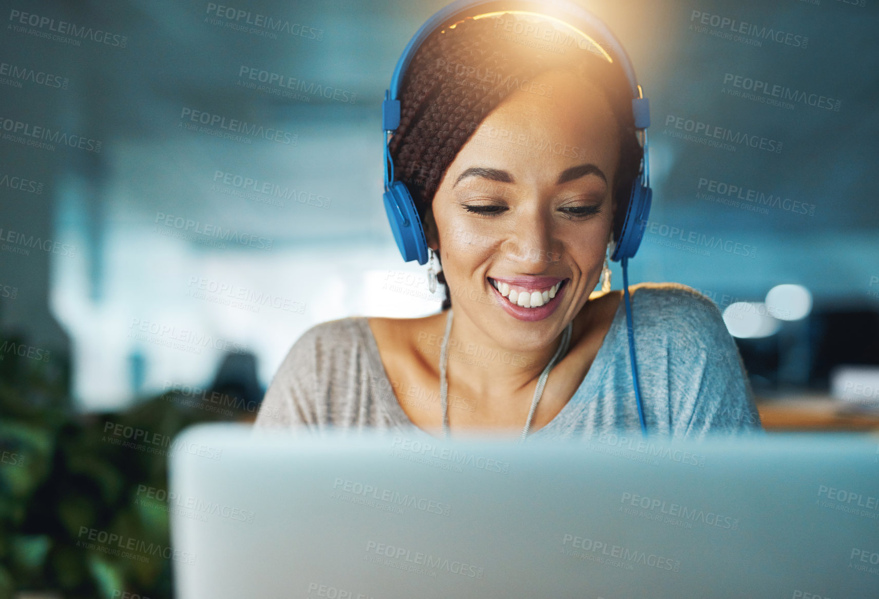 Buy stock photo Woman, laptop and headphones for business news with research and project deadline at night. Web designer, technology and music app in workplace for website, streaming and podcast inspiration