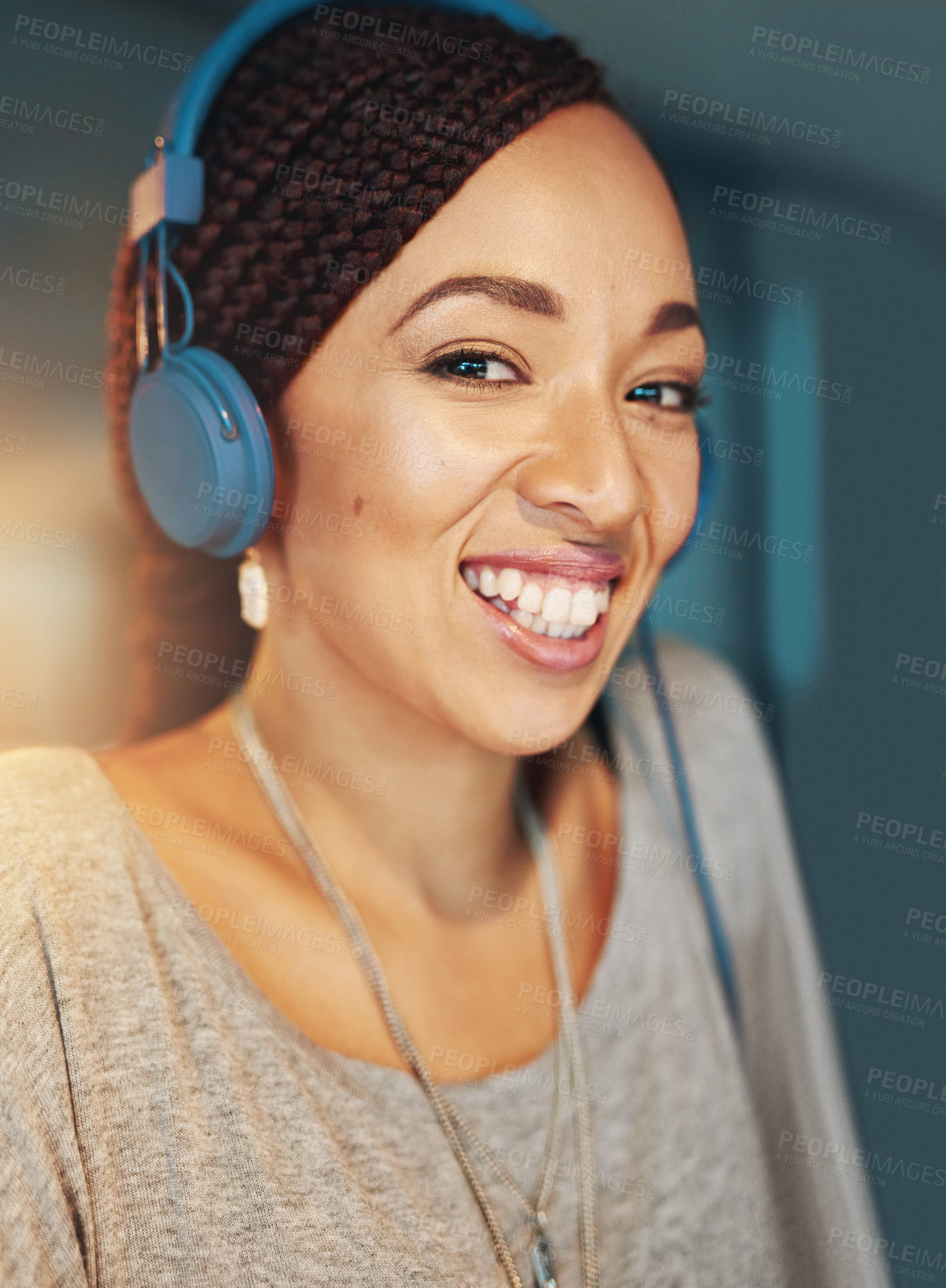 Buy stock photo Business woman, portrait and headphones in office for radio, commitment and project deadline at night. Web designer, technology and music app in workplace for podcast, streaming or listening to audio