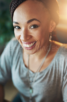 Buy stock photo Cropped portrait of a young woman working late in her office